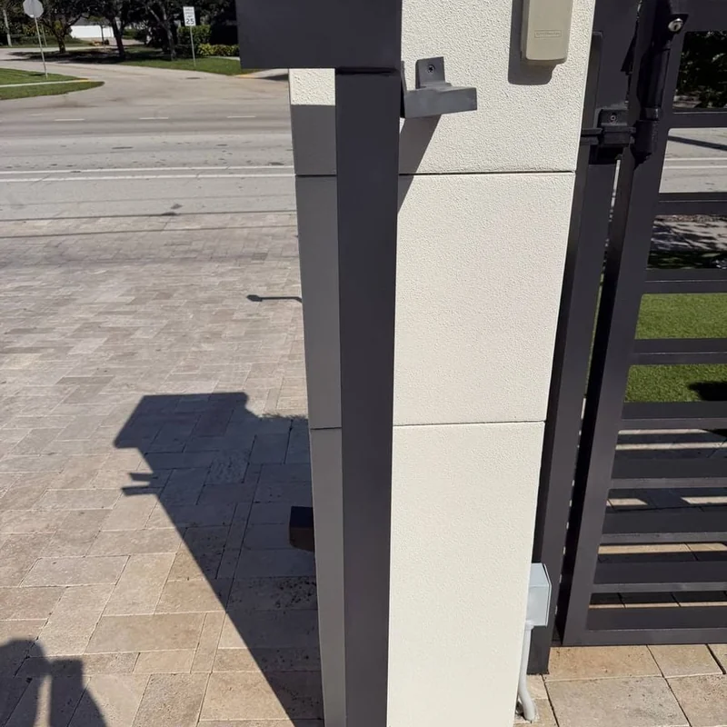 Anodized aluminum gate post after restoration Fort Lauderdale — deep charcoal color restored without paint