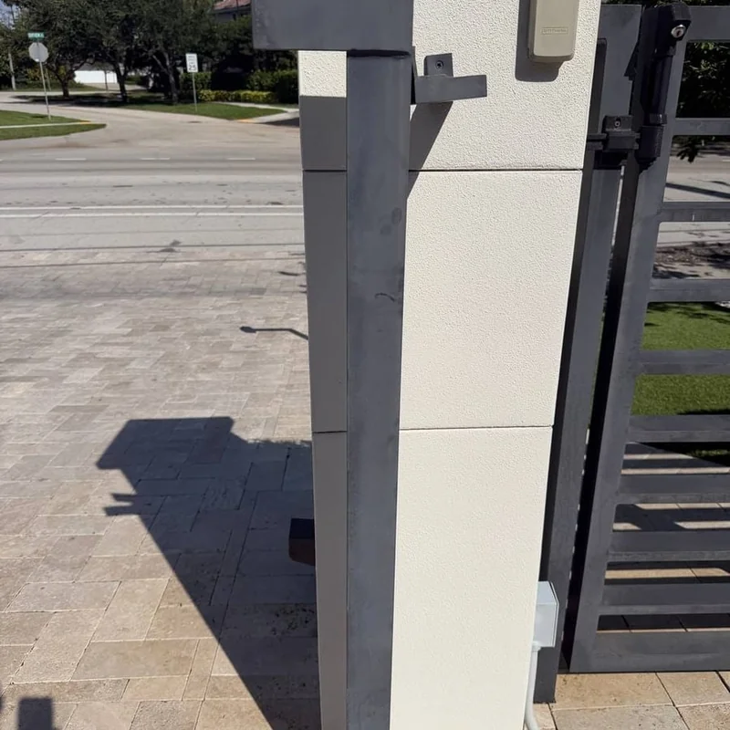 Anodized aluminum gate post before restoration Fort Lauderdale — faded and oxidized from sun and salt